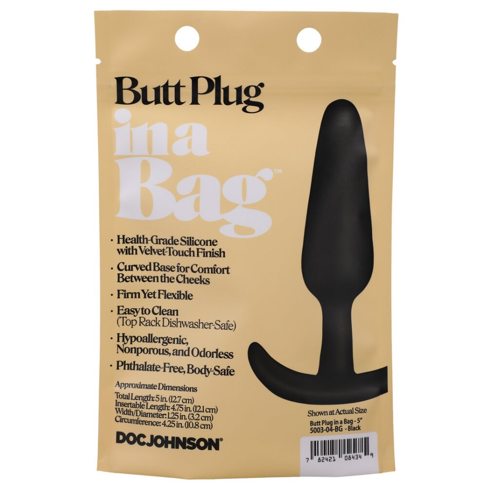 Beige Verpackung mit Text und der Abbildung eines schwarzen Butt-Plugs.