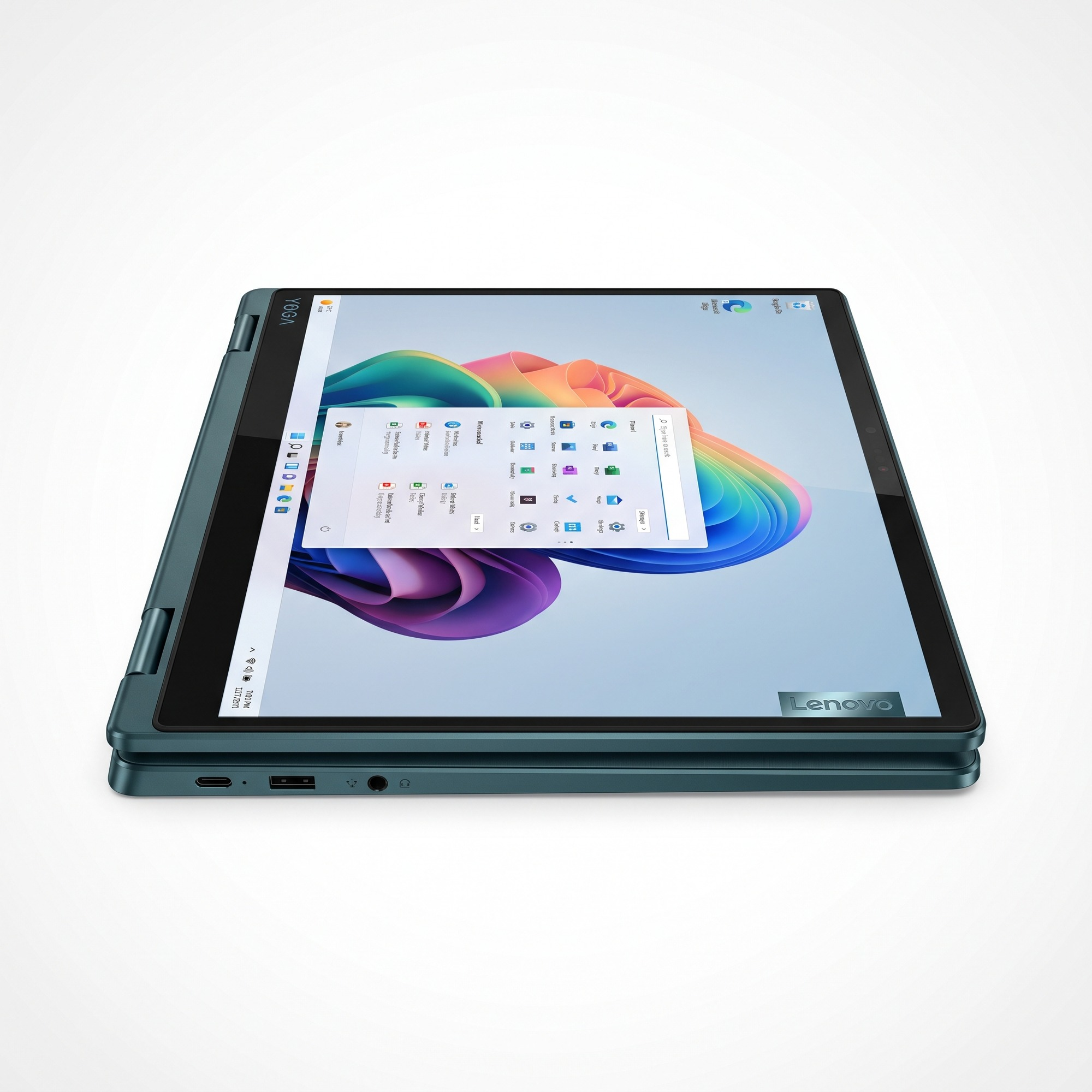 Kapalı turkuaz renkli bir Lenovo Yoga dizüstü bilgisayar yandan görünümde, bağlantı noktaları ve renkli ekran koruyucusuyla.