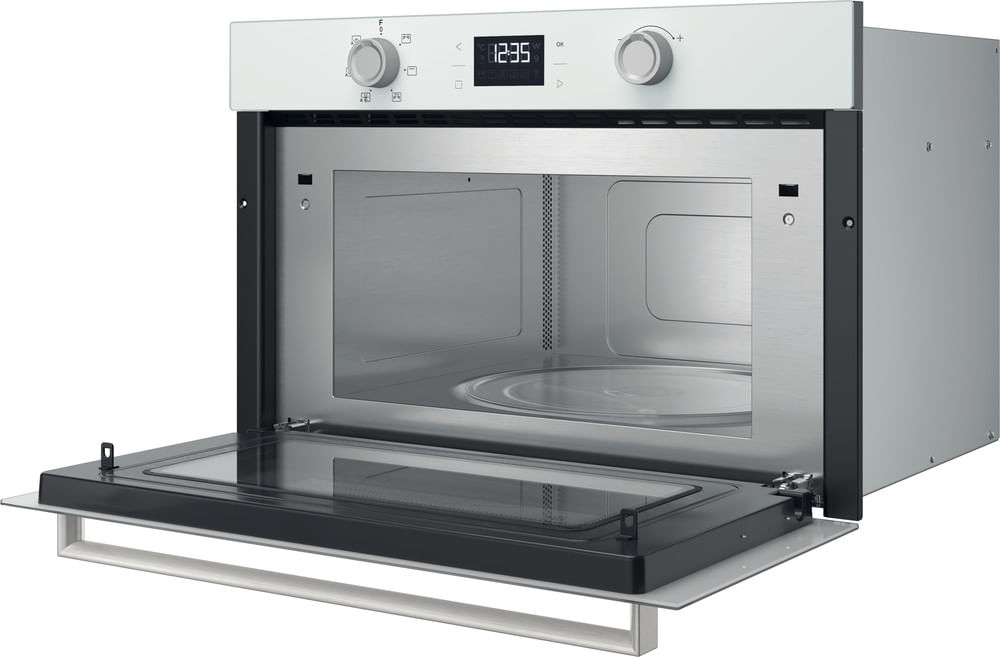 Un forno da incasso bianco con porta in vetro aperta e interno in acciaio inossidabile.