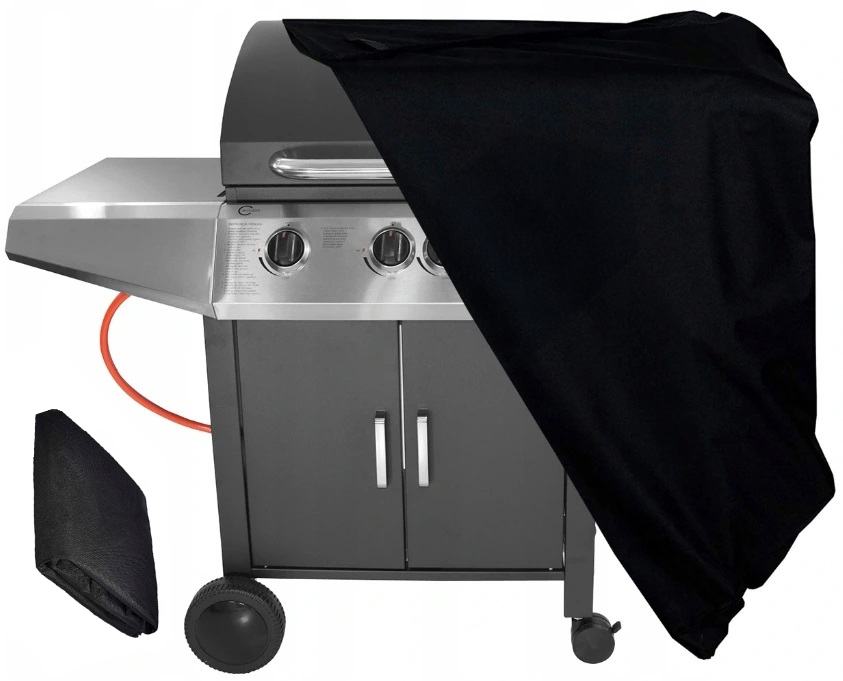 Nowoczesny grill gazowy z panelem sterowania ze stali nierdzewnej, częściowo przykryty czarnym pokrowcem.
