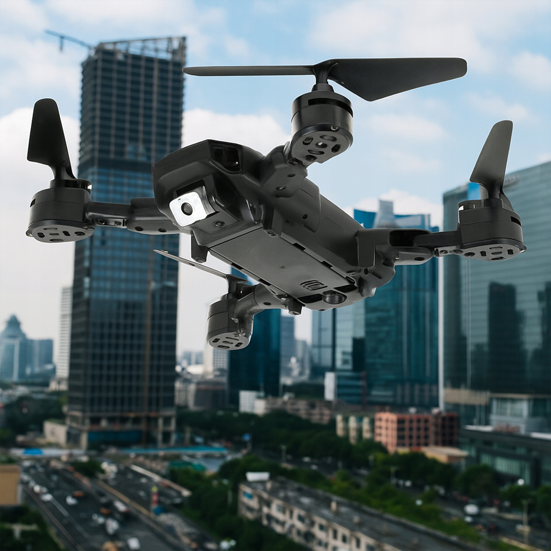 Czarny dron unosi się w powietrzu nad miastem z wysokimi budynkami.
