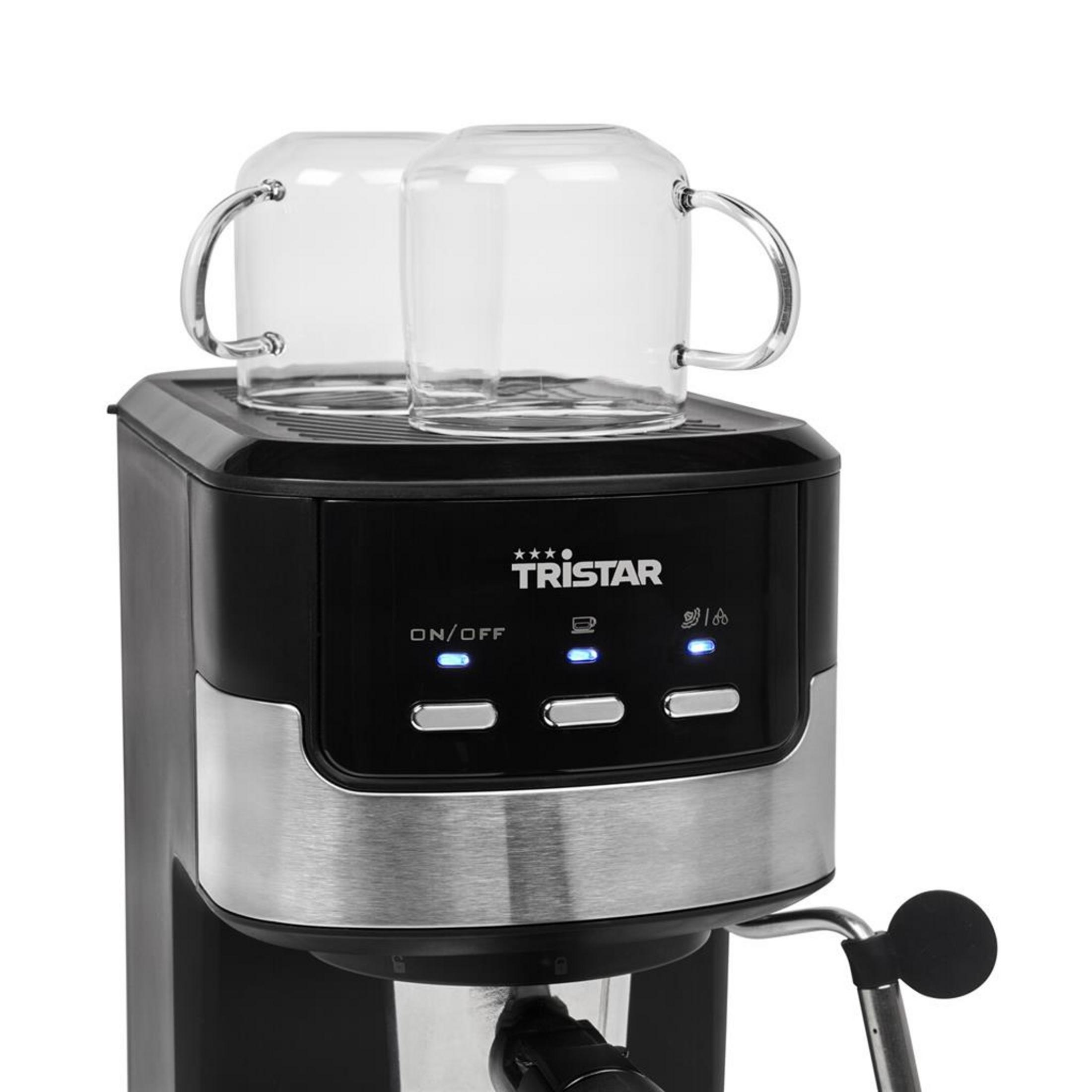 Una macchina da caffè espresso Tristar nera e argento con due tazze di vetro sopra.