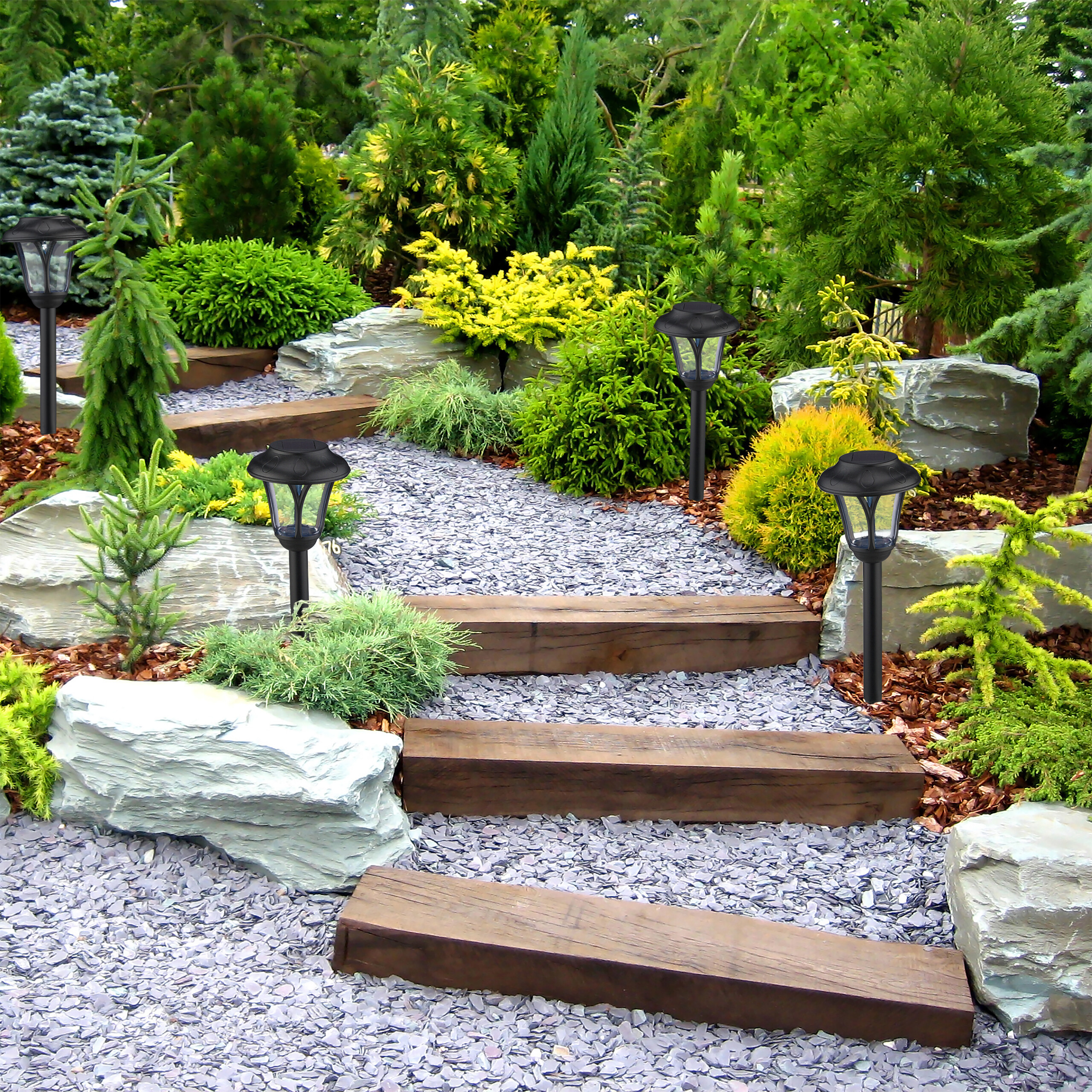 Ein Steinweg mit Holzstufen schlängelt sich durch einen üppigen Garten mit Steinen, Sträuchern und Solarleuchten.