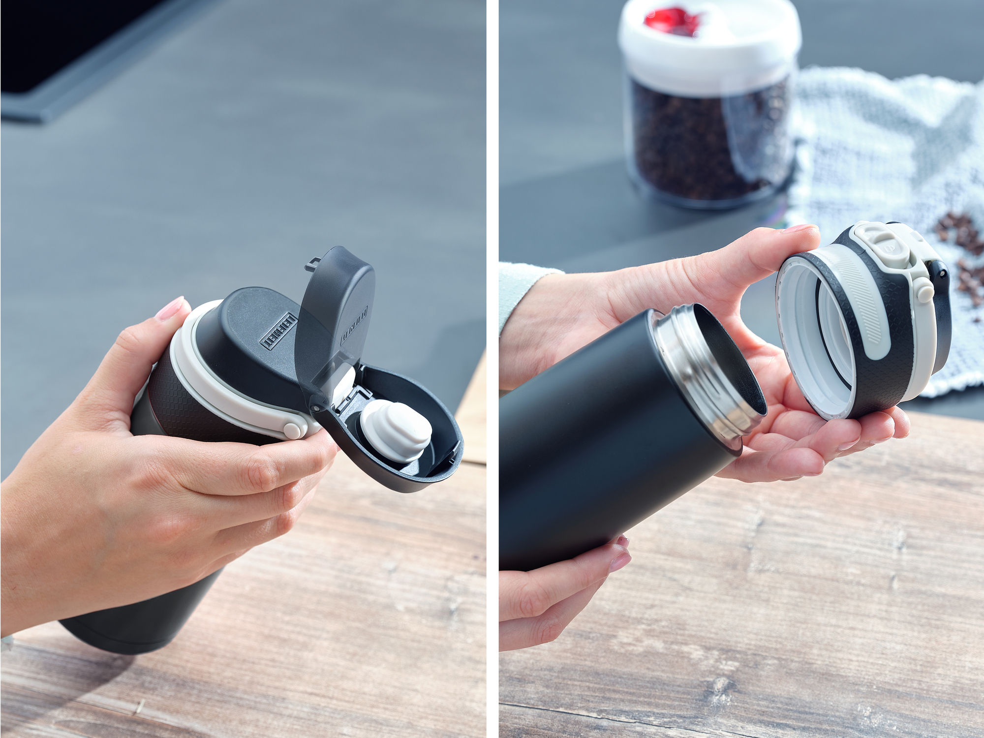Hände öffnen einen schwarzen Thermobecher mit weißem Verschluss auf einer Holzoberfläche.