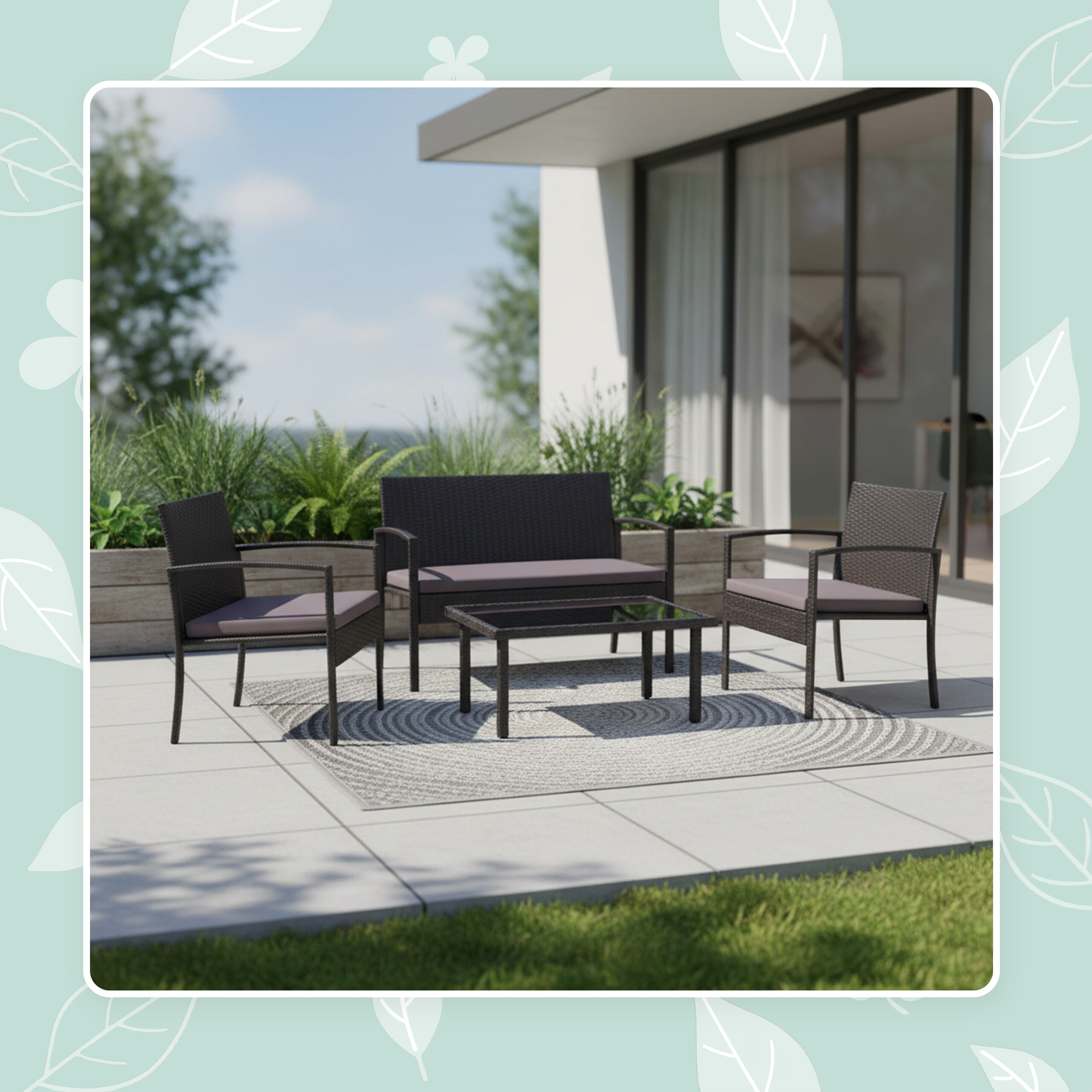 Moderne Rattan-Gartenmöbel mit Tisch und Kissen auf einer grauen Terrasse.