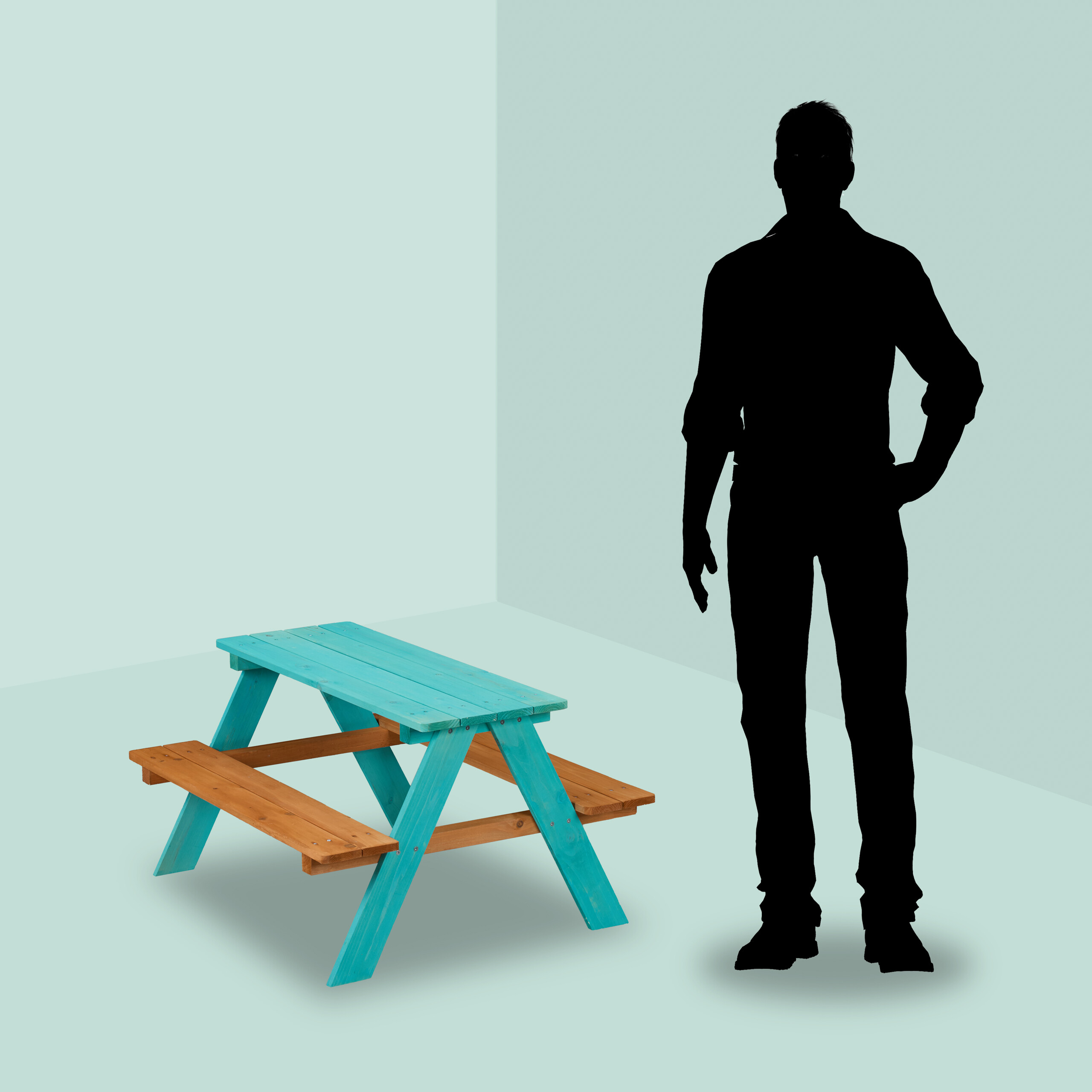 Eine blau-braune Picknickbank und eine schwarze Personen-Silhouette vor hellem Hintergrund.