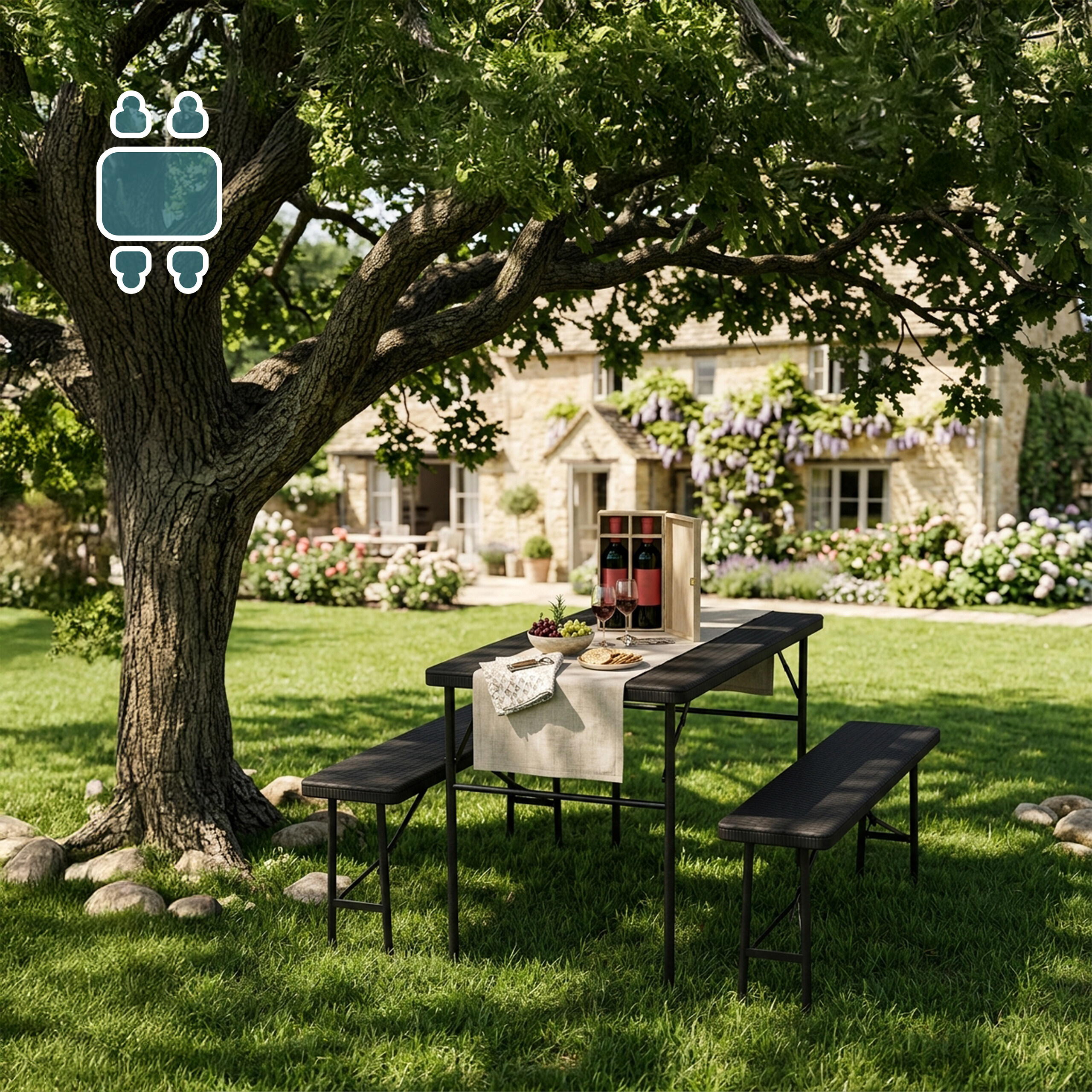 Ein Picknicktisch mit Bänken unter einem großen Baum im grünen Garten und einem Steinhaus im Hintergrund.