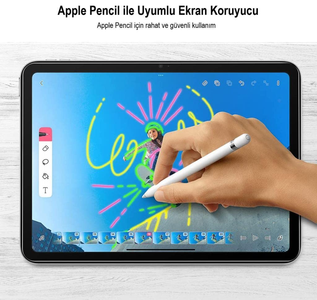 Renkli çizim içeren bir tablet ekranında Apple Pencil ile çizen el.