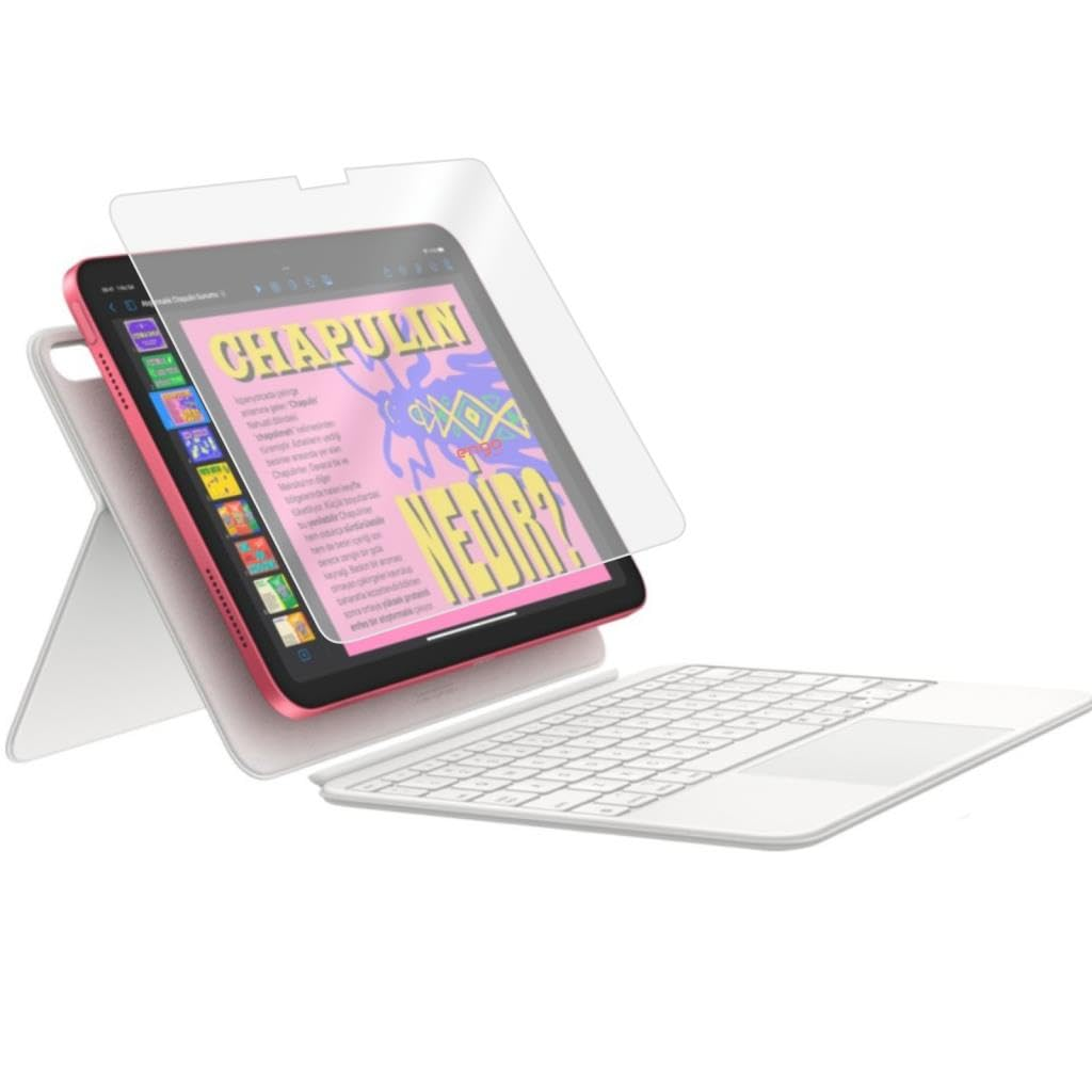 Beyaz klavyeli stand üzerinde pembe tablet, ekranda renkli grafikler gösteriyor.