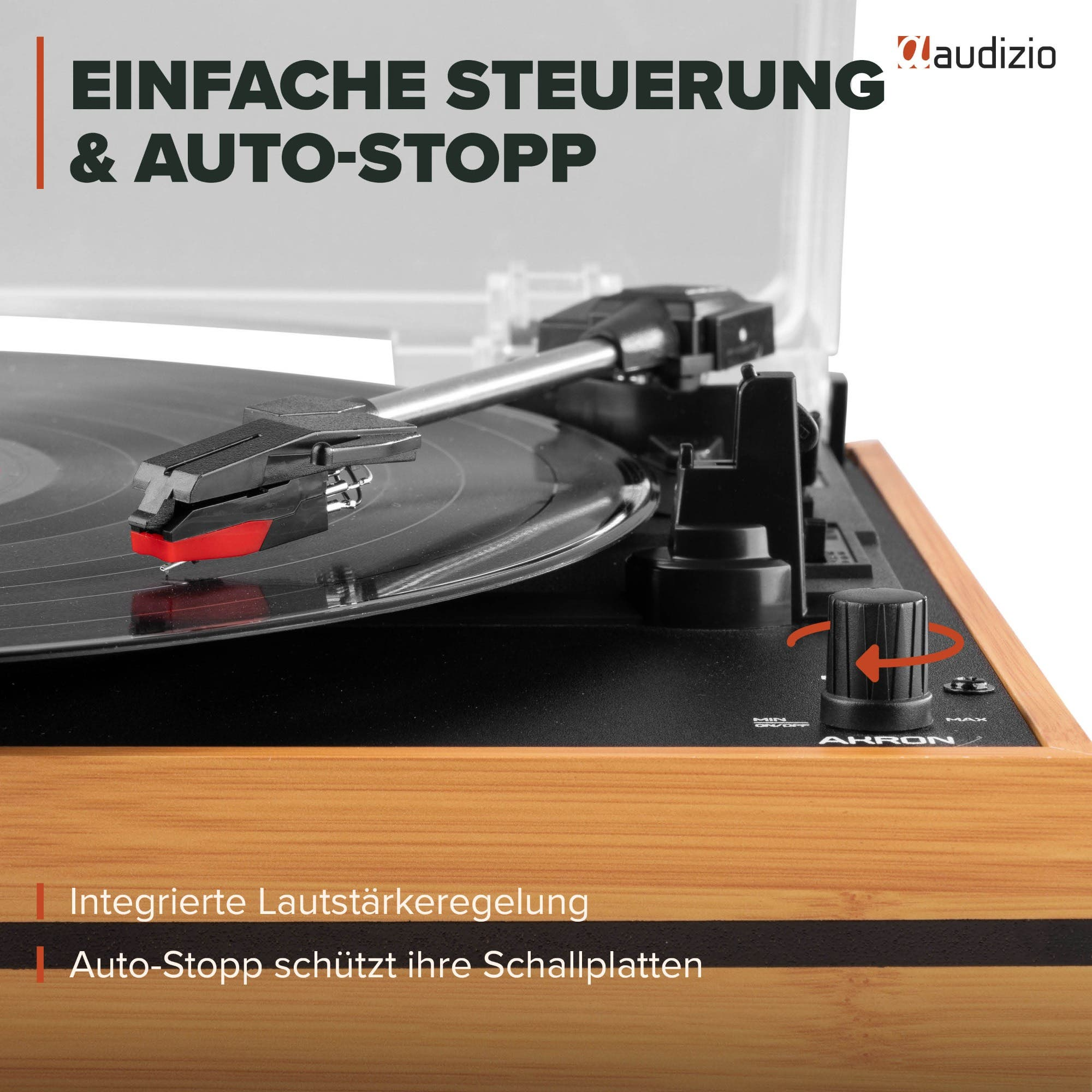 Tocadiscos Audizio de madera con brazo, aguja roja y control de volumen sobre base negra.