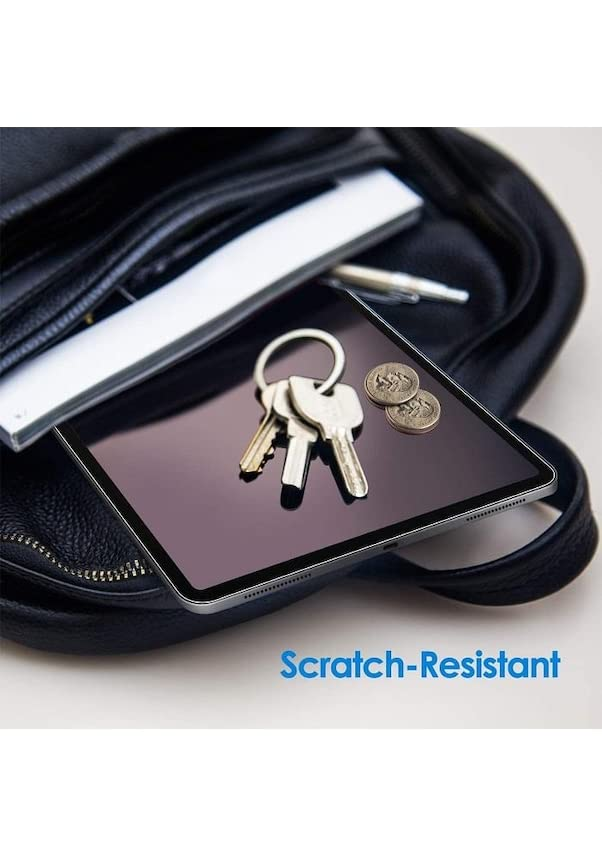 Siyah deri çantadaki bir tablet üzerinde anahtar ve madeni paralar. Metin: Scratch-Resistant.