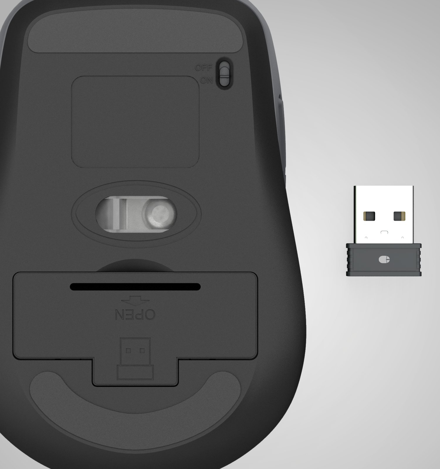 Vista inferior de un ratón inalámbrico negro, mostrando su sensor óptico, interruptor y un receptor USB al lado.