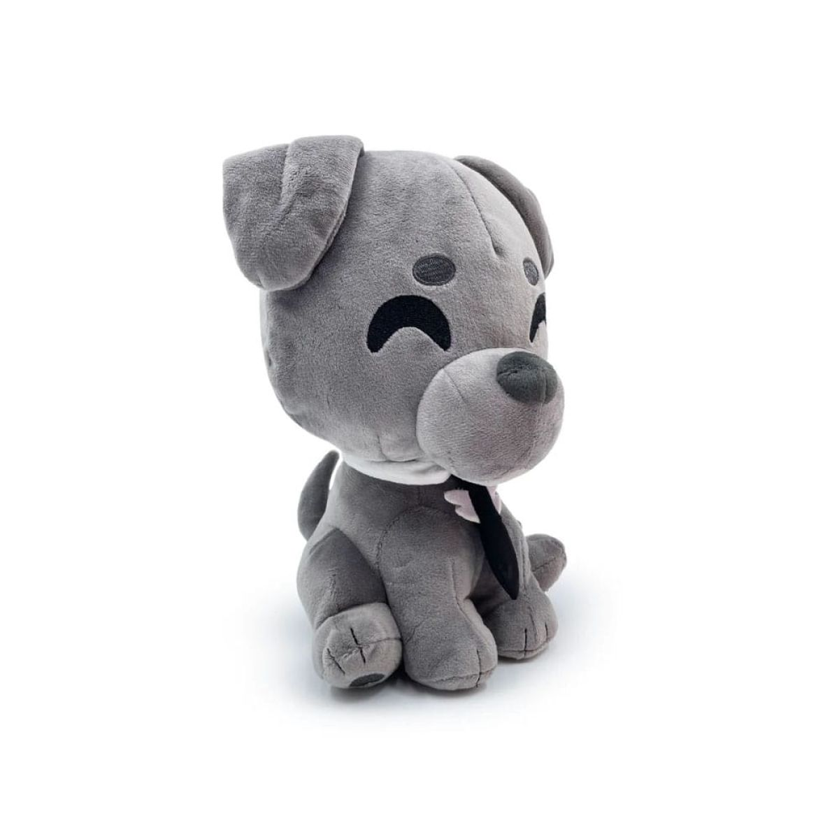 Un perro de peluche gris con cuello blanco y corbata negra, sentado sobre fondo blanco.