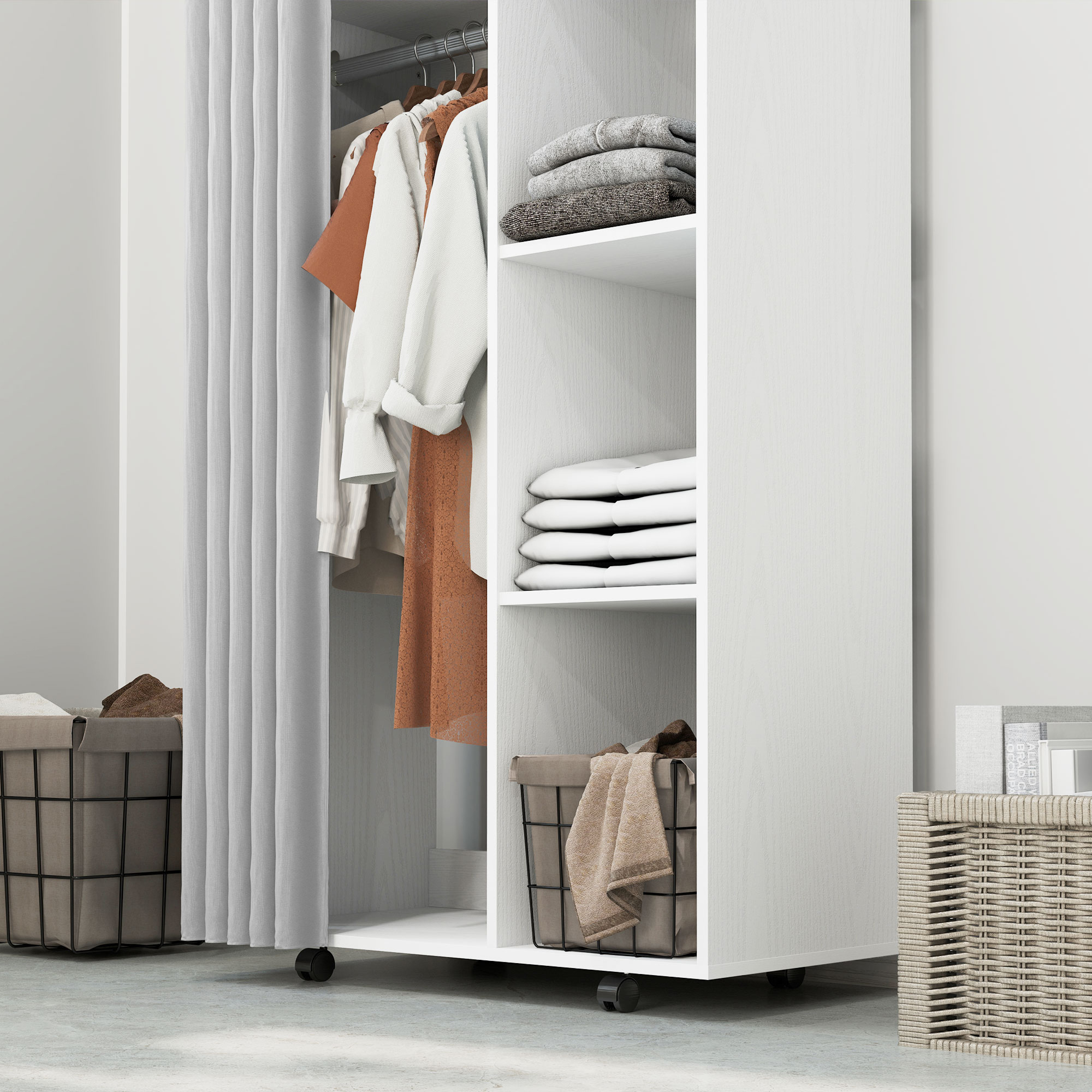 Un armario de madera blanca con ropa colgada, jerséis doblados y cestas de almacenamiento en una habitación luminosa.
