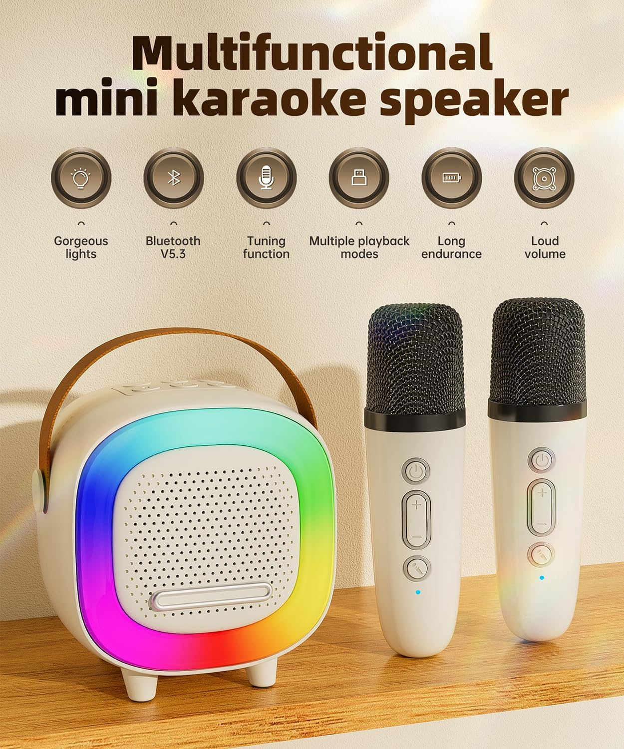 Mini-Karaoke-Set mit weißem Lautsprecher, bunten LED-Lichtern und zwei passenden Mikrofonen auf einer Holzoberfläche.