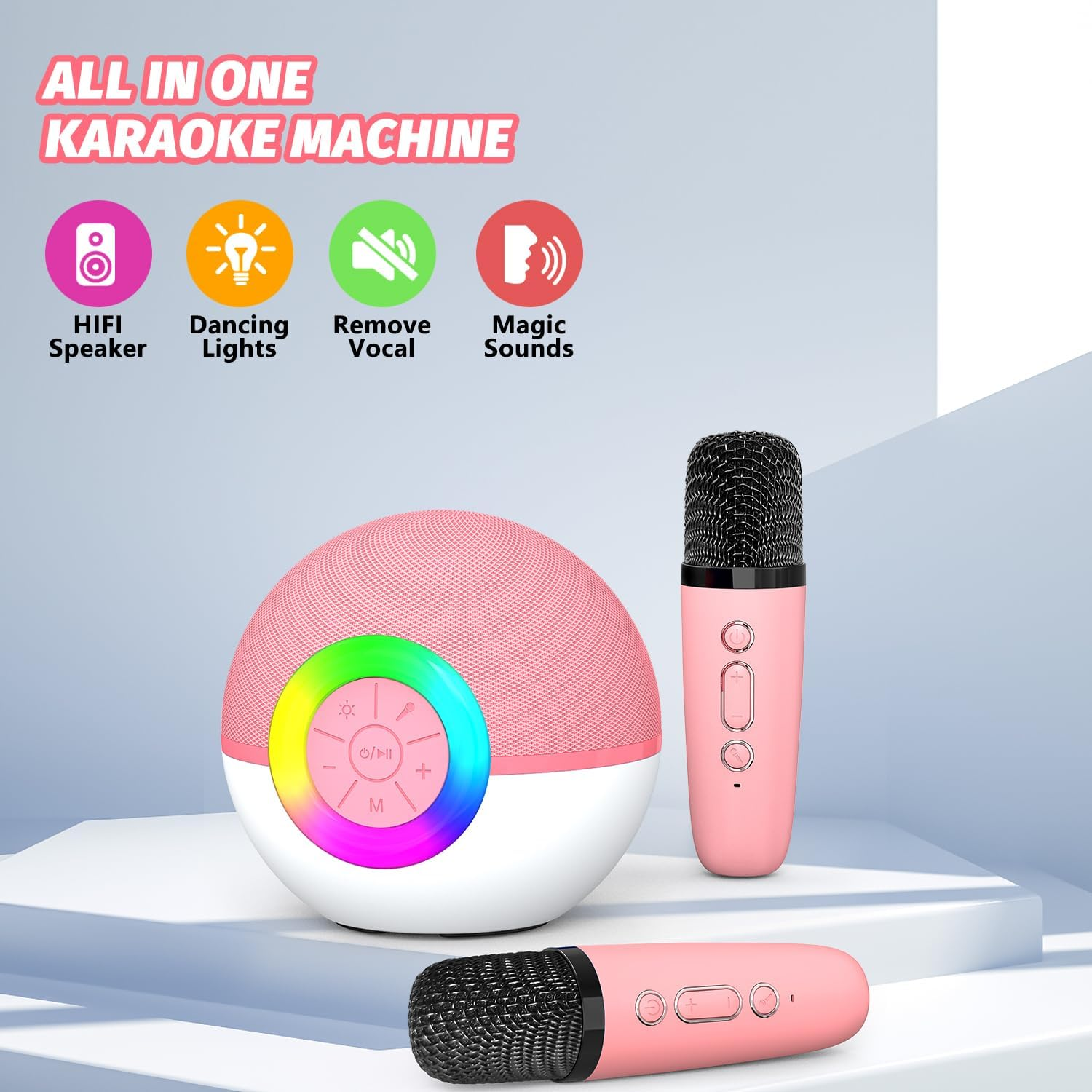 Rosa Karaoke-Maschine mit rundem Lautsprecher und zwei Mikrophonen auf weißem Hintergrund.