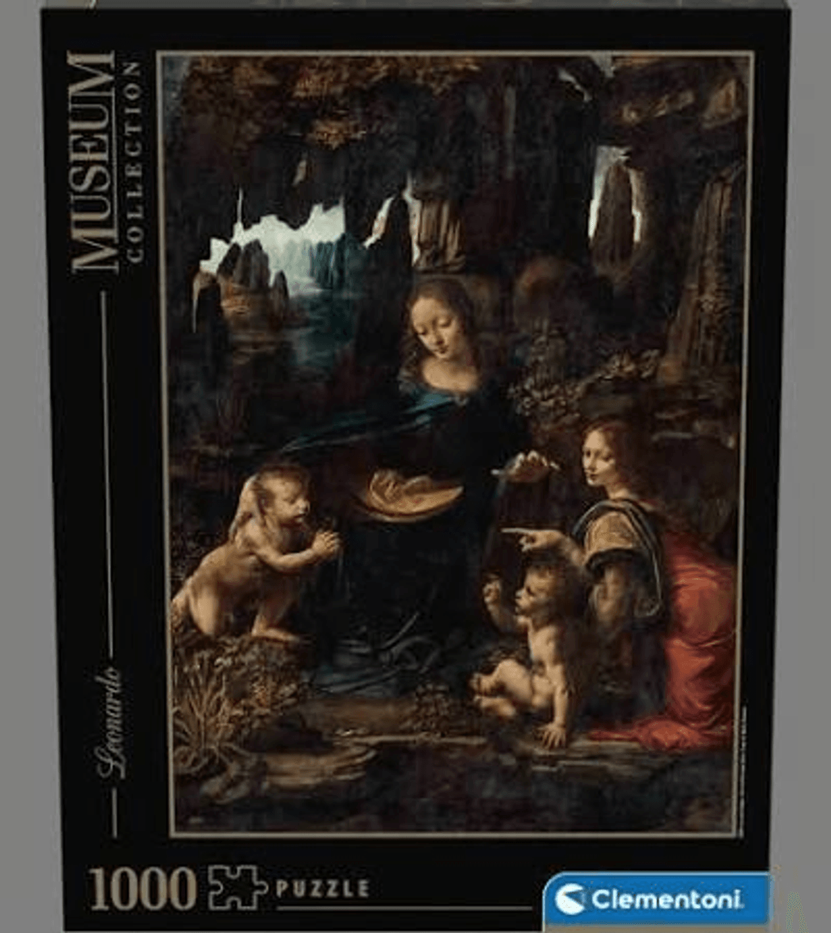 Caja de puzle con la Virgen de las Rocas de Leonardo da Vinci mostrando figuras en una cueva.