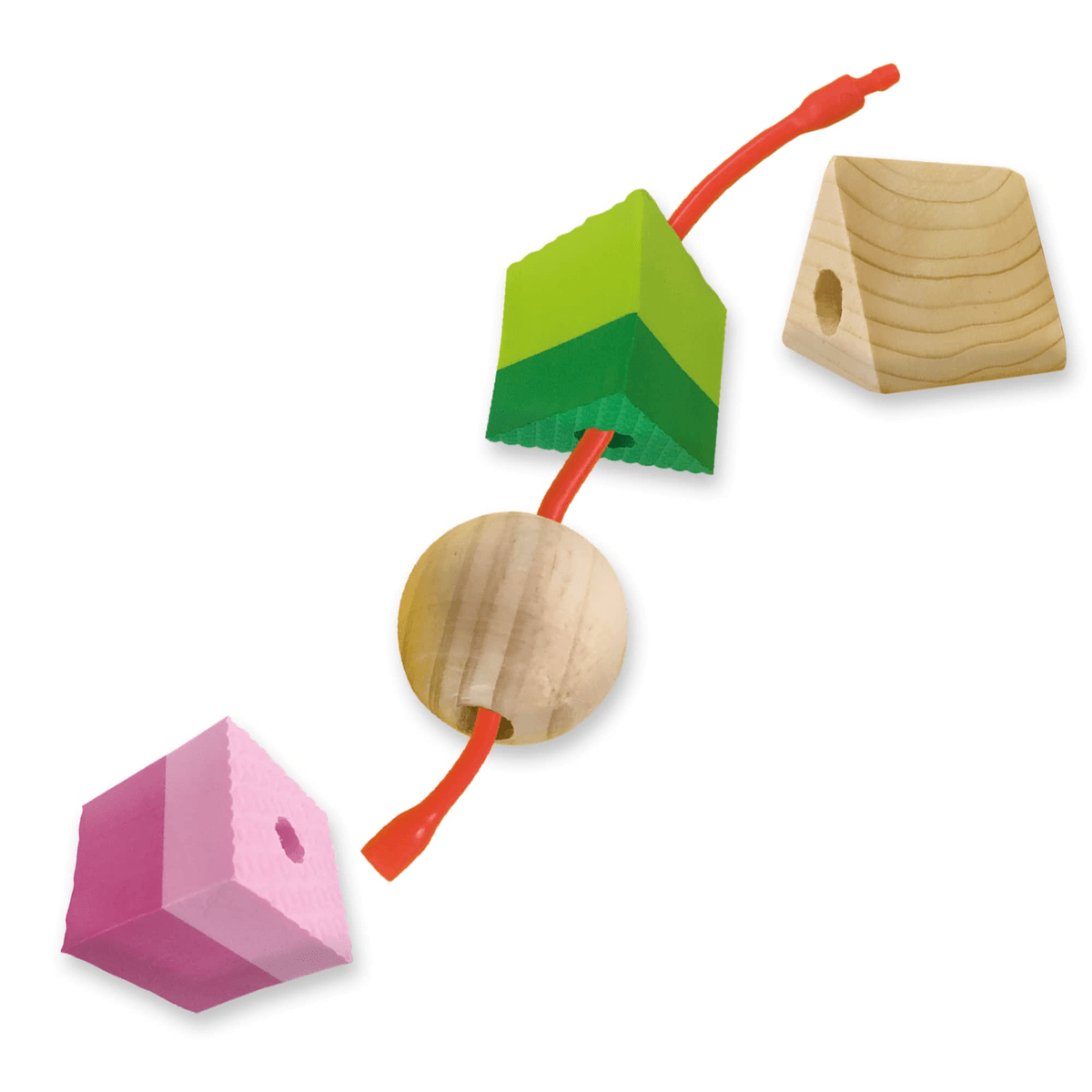 Un hilo rojo pasa a través de varias formas de madera y espuma, incluyendo un cubo rosa, una esfera y bloques verdes.