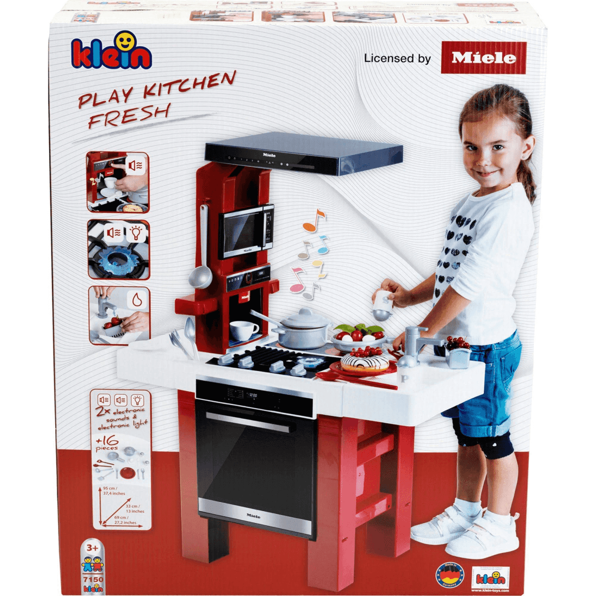 Embalaje de una cocina de juguete Miele con comida, accesorios y una niña sonriente.