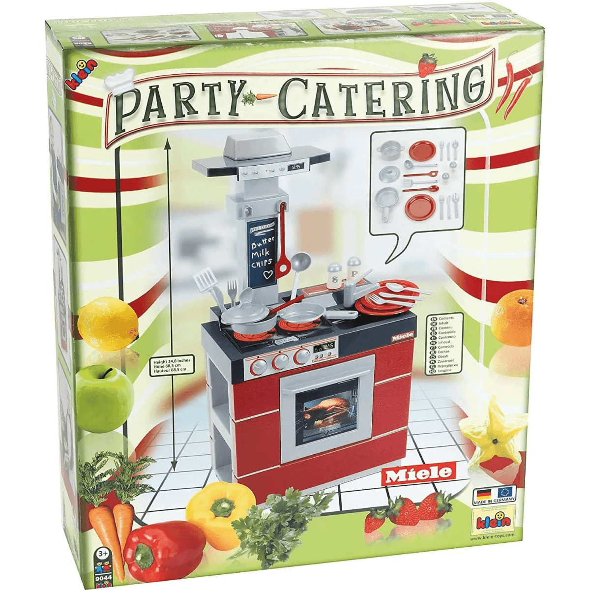Caja de una cocinita de juguete Miele roja con accesorios y frutas.