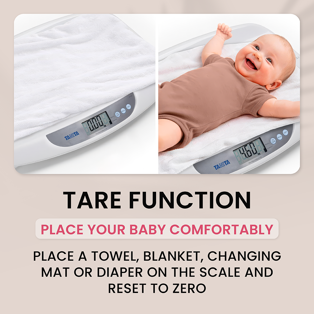 A baby scale showing the tare function with a towel placed on it and a happy baby lying on top.