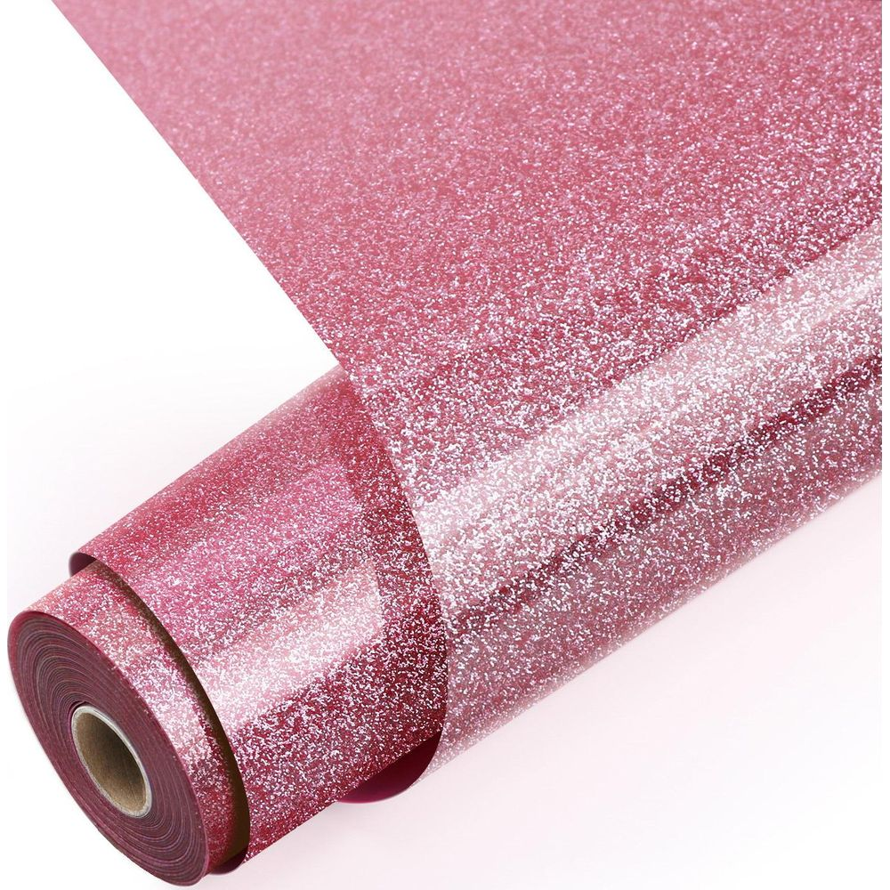 Eine Rolle glänzendes, rosa Glitzerpapier vor weißem Hintergrund.