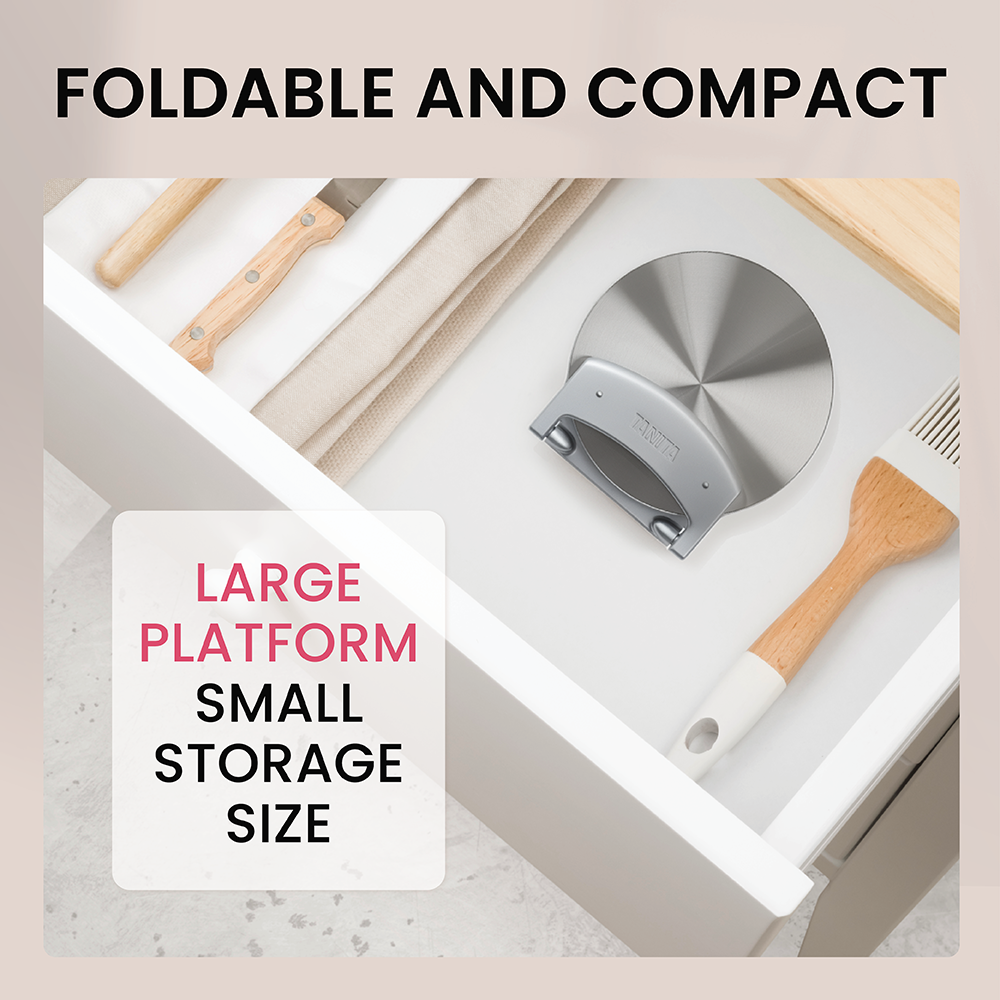 A foldable kitchen scale and utensils stored in a white drawer.