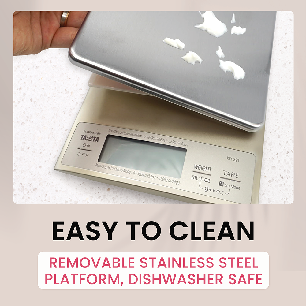 A hand lifts the removable stainless steel platform off a Tanita kitchen scale.