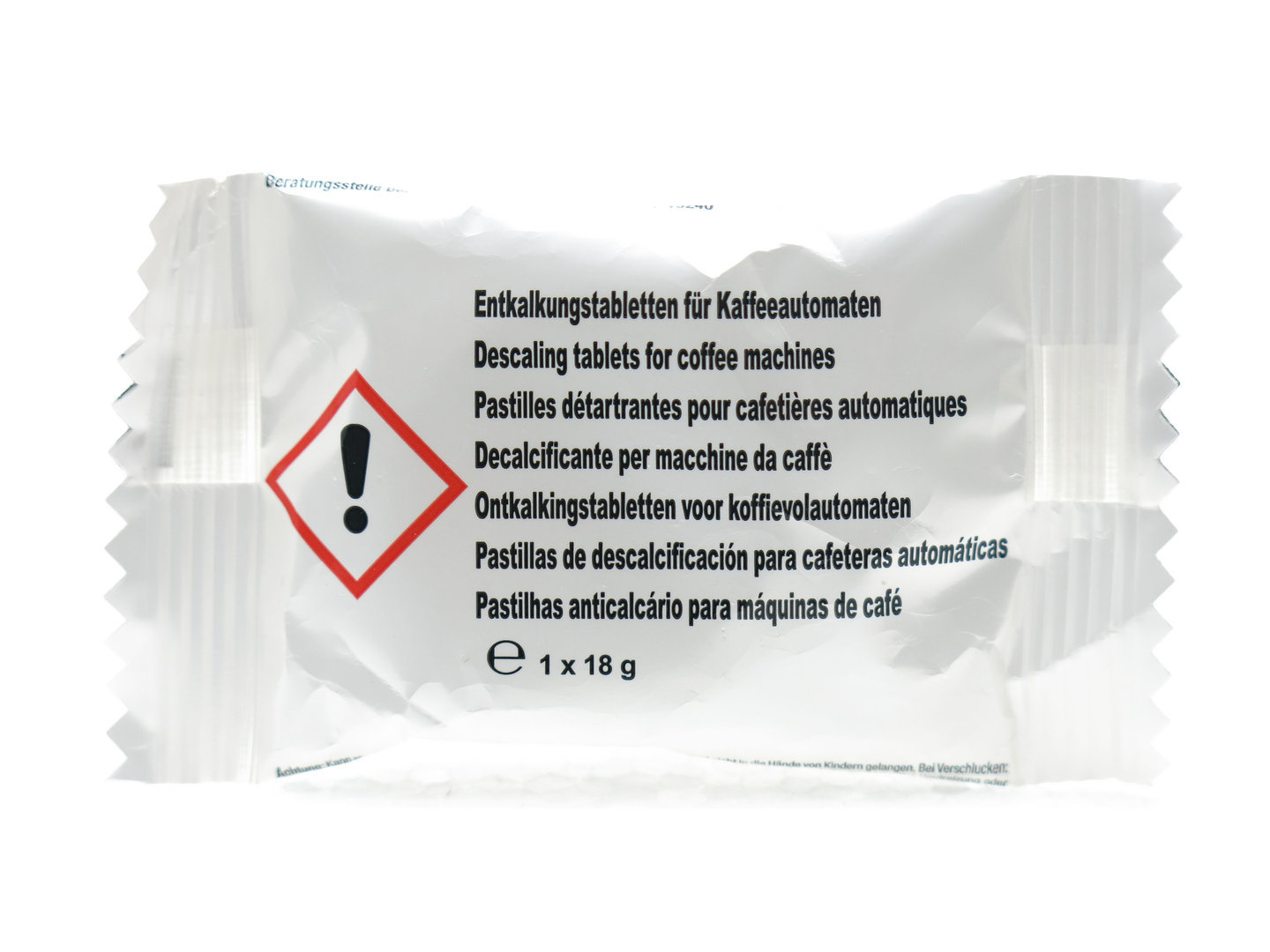 White packaging of descaling tablets with warning symbol.