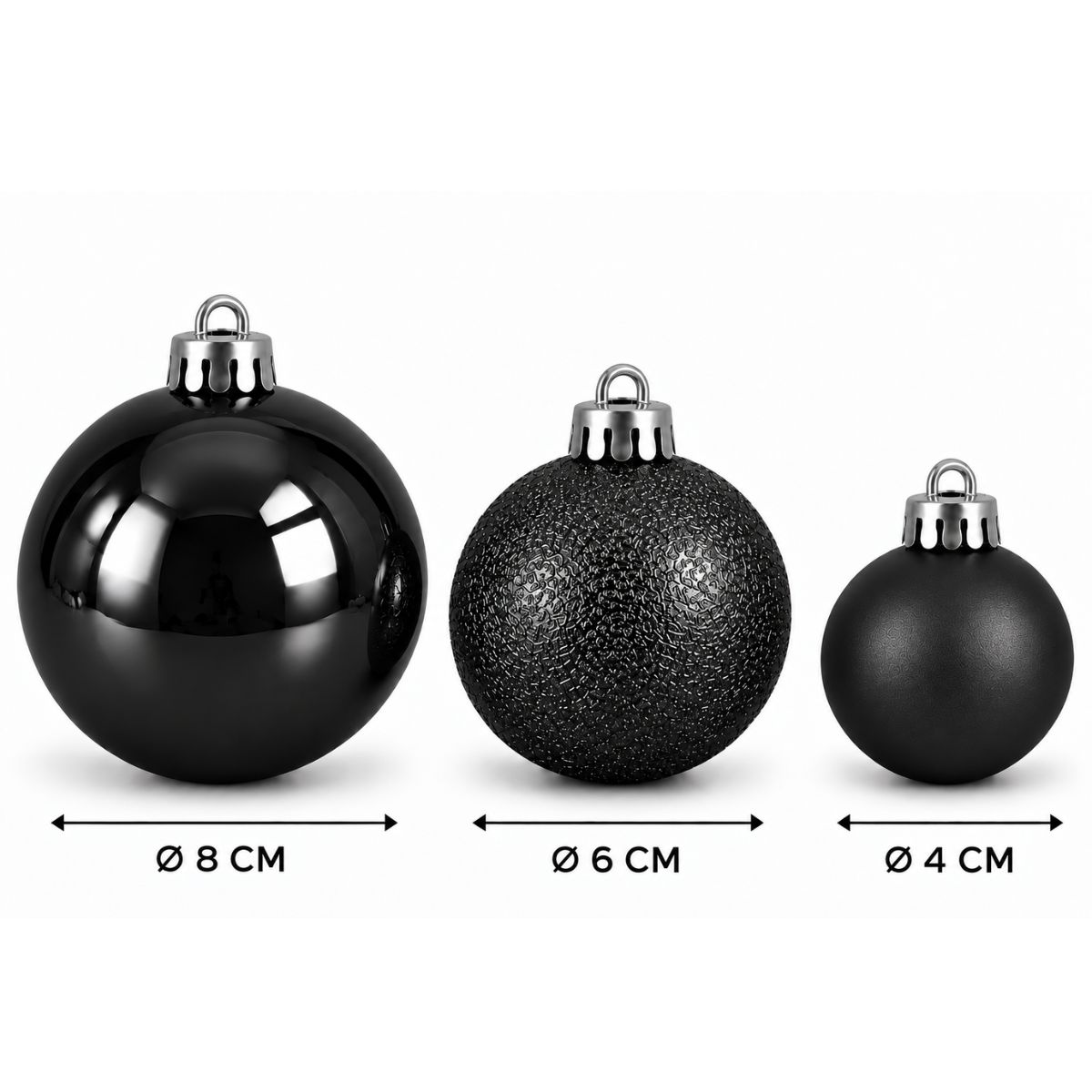 Trois boules de Noël noires avec des capuchons argentés de 8 cm, 6 cm et 4 cm sur fond blanc.