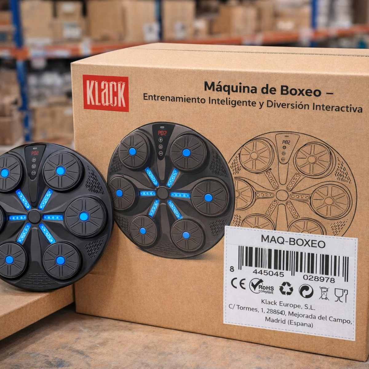 Una caja para máquina de boxeo con imagen del dispositivo y etiqueta de código de barras.