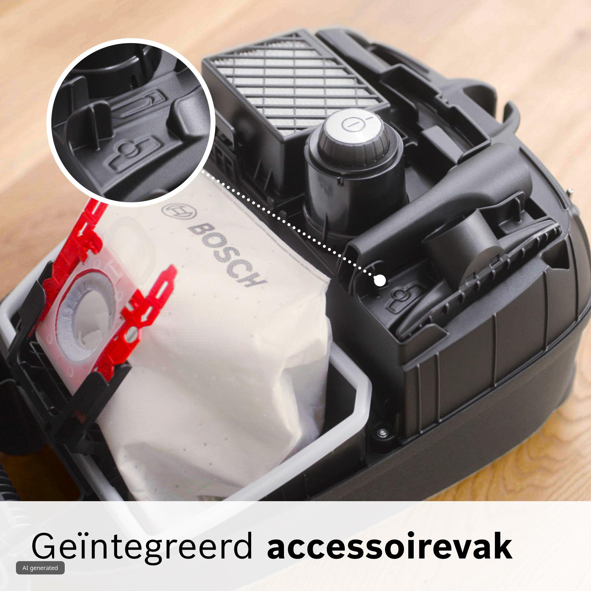 Een open Bosch stofzuiger met geïntegreerd accessoirevak en stofzak op een houten ondergrond.
