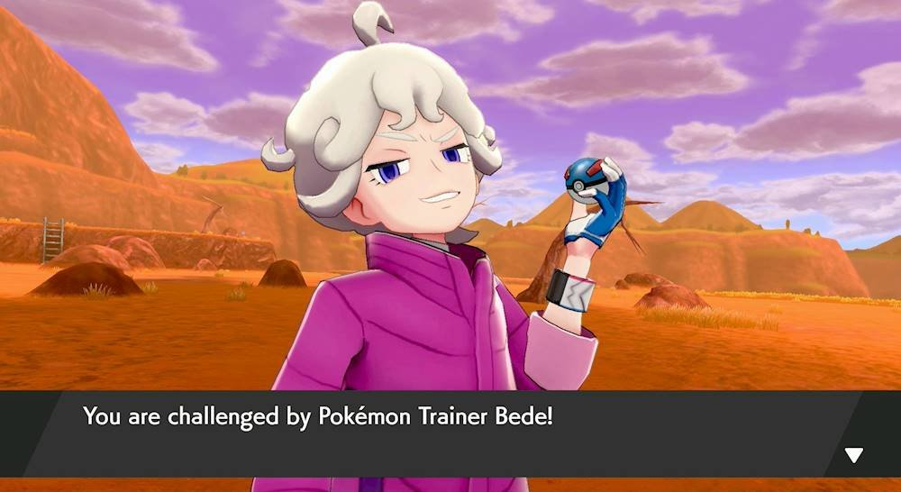 Bede in cappotto viola tiene una Poké Ball, con paesaggio desertico e testo di battaglia.