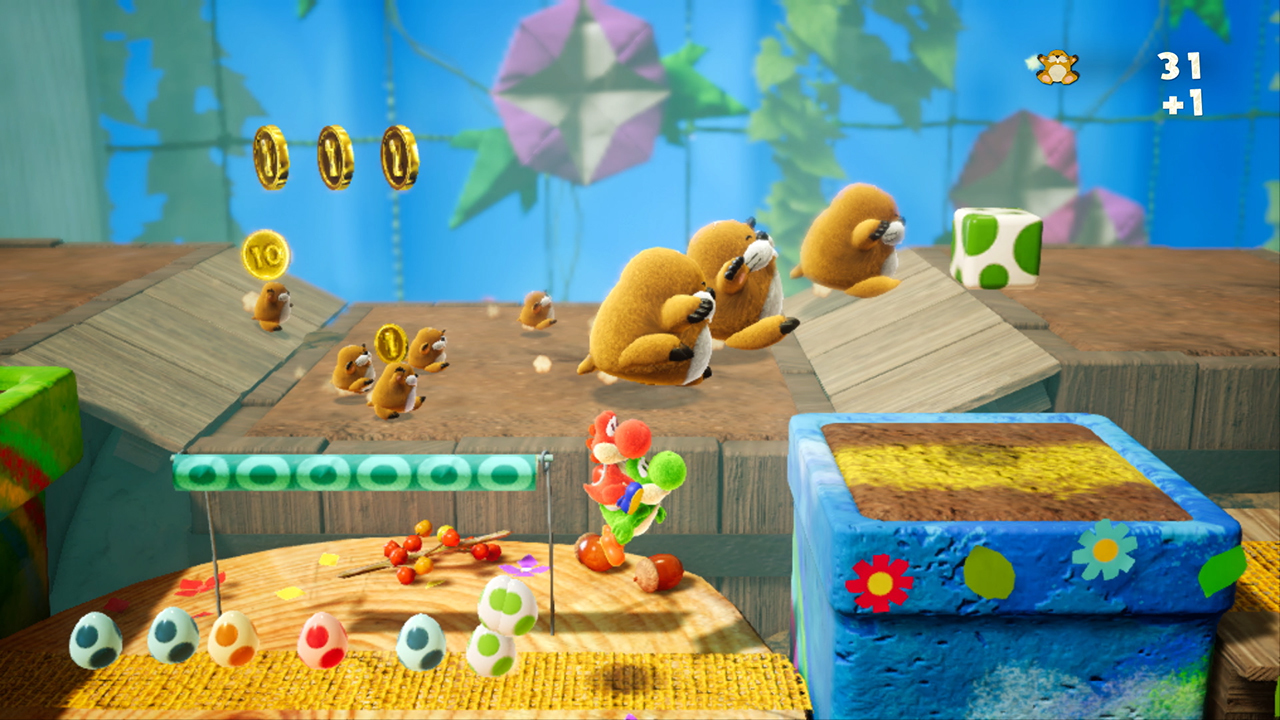 Una escena de videojuego con Yoshi lanzando huevos entre pequeños topos en un mundo de papel colorido.