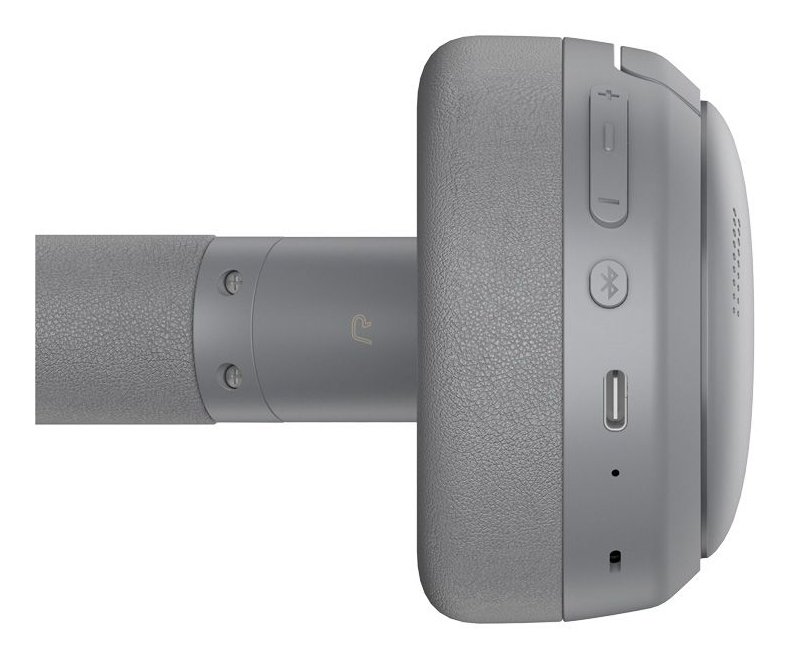 Zbliżenie szarych słuchawek z przyciskami głośności, ikoną Bluetooth i portem ładowania na nauszniku.