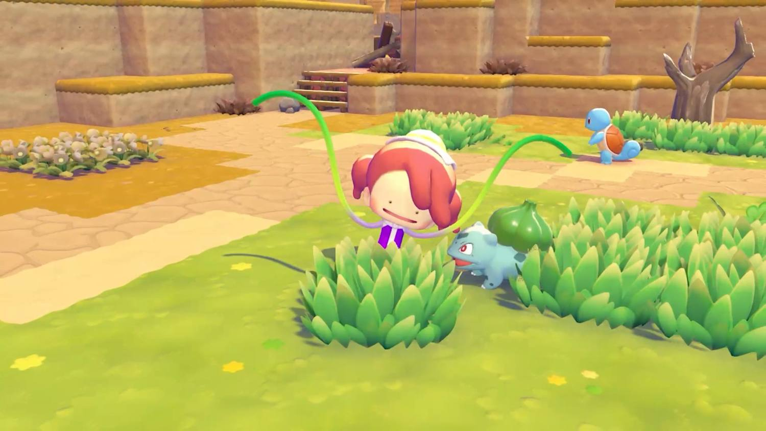 Un personaje rosado rebota cerca de arbustos, mientras un Squirtle azul está en el fondo.