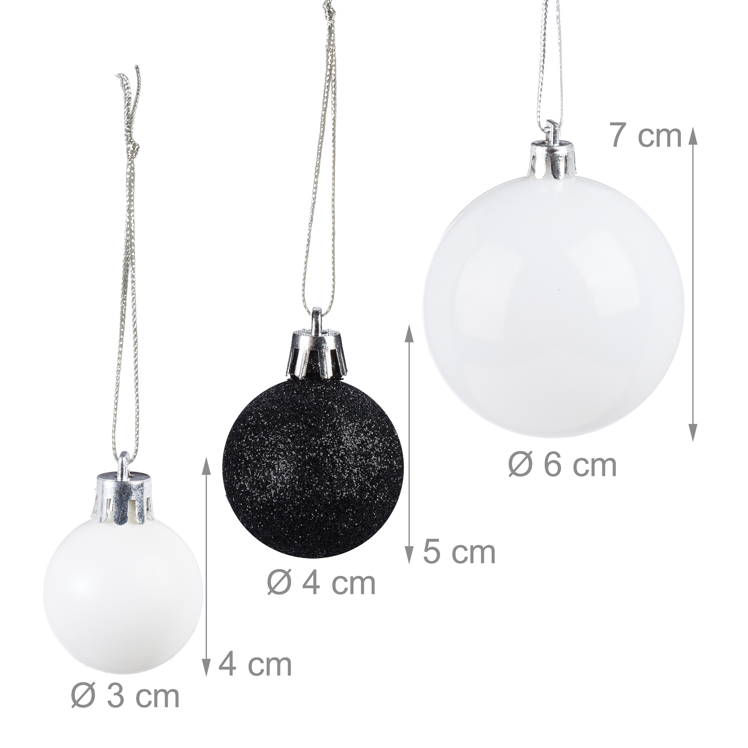 Drei Weihnachtskugeln in Weiß, Schwarz mit Glitzer und Weiß, mit Durchmessern von 3cm, 4cm und 6cm.