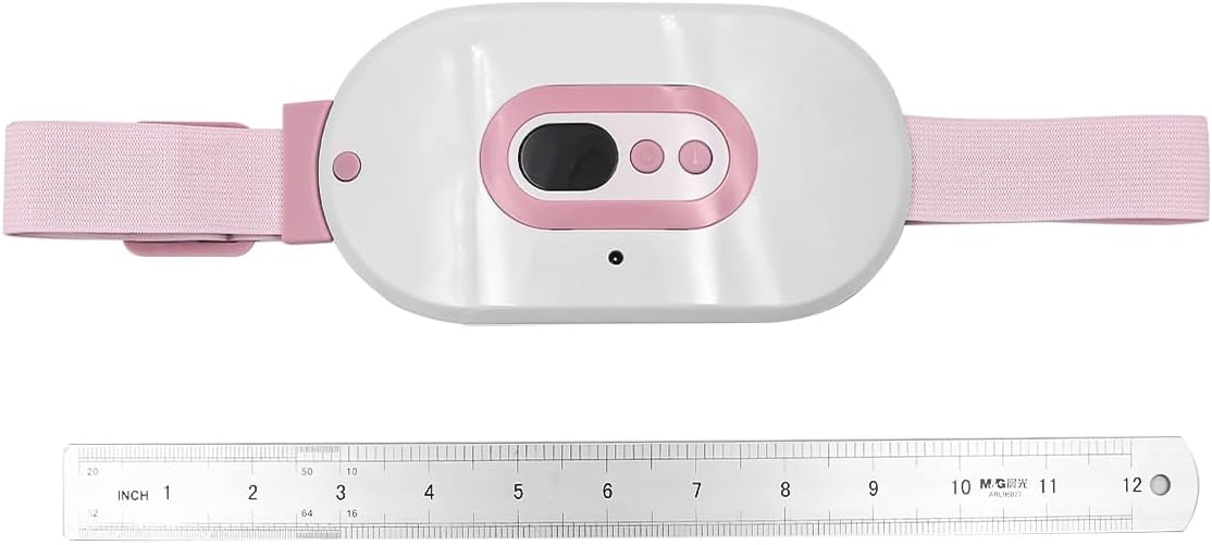Weißes und rosa Wärmeband mit Digitaldisplay und elastischen Trägern, unterhalb liegt ein Metalllineal.