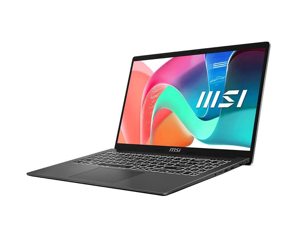 Srebrny laptop MSI stoi na białej powierzchni, wyświetlając kolorowy ekran.