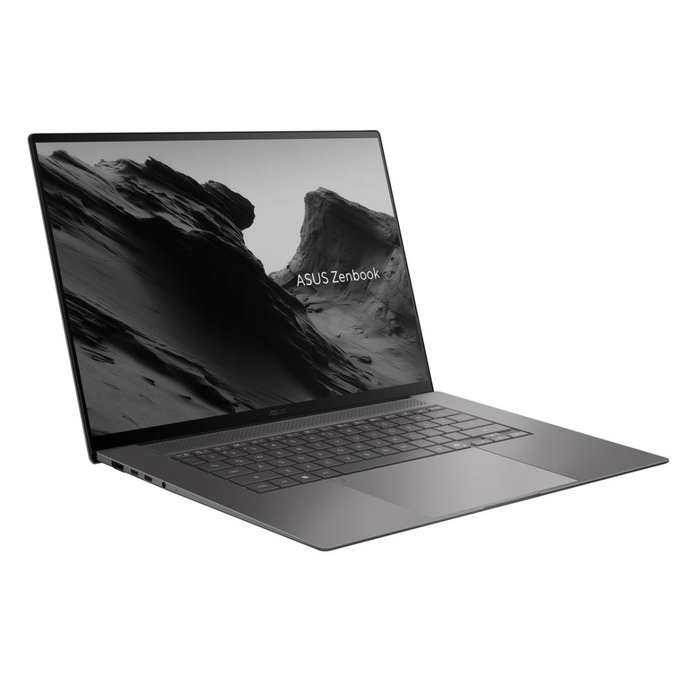Szary laptop ASUS Zenbook na białym tle z górską tapetą.
