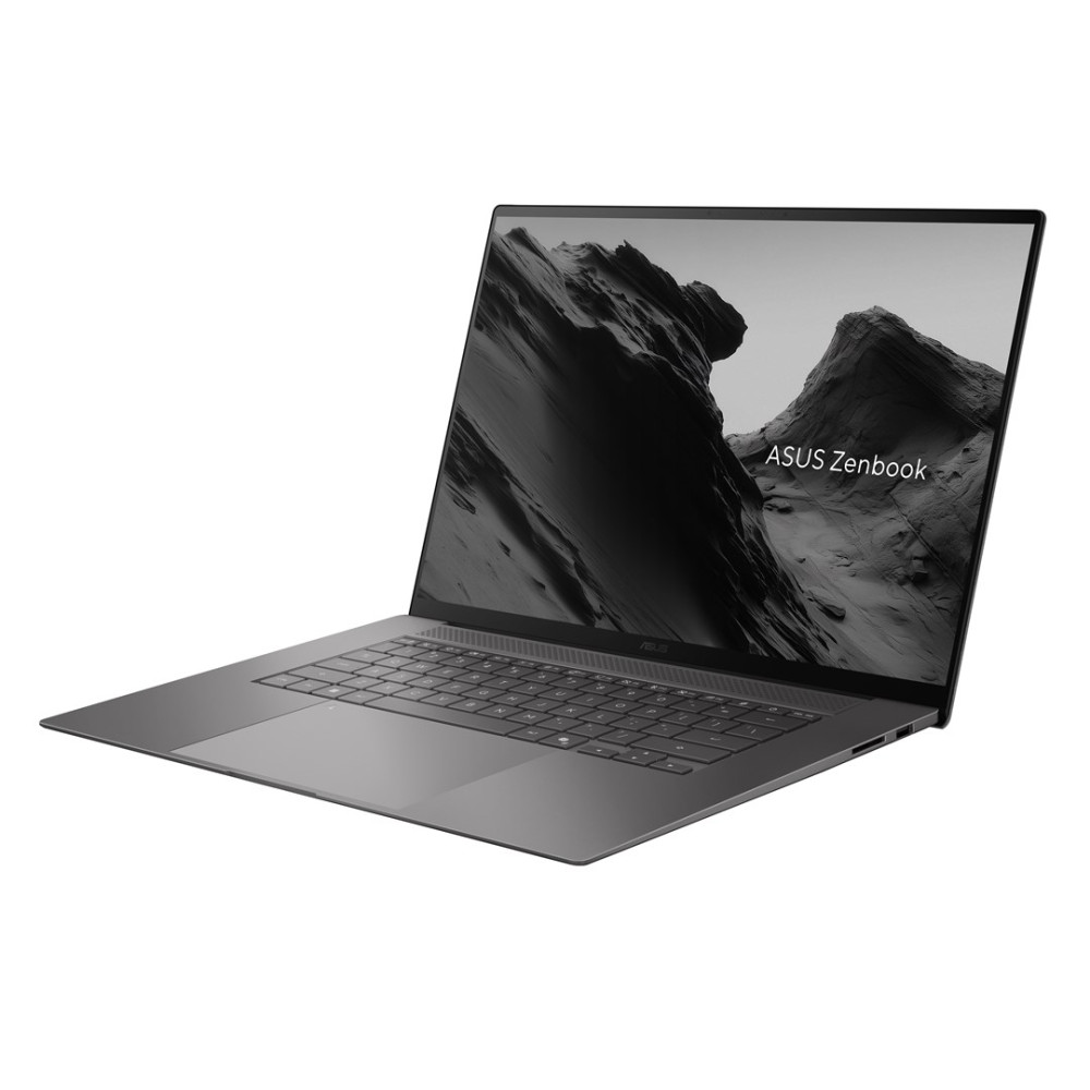 Szary laptop ASUS Zenbook na białym tle z górami wyświetlanymi na ekranie.
