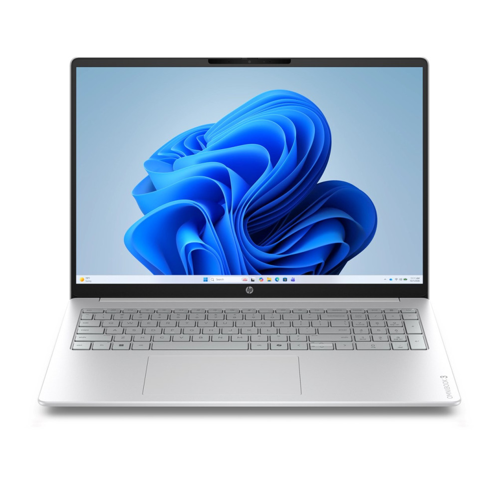 Srebrny laptop wyświetlający niebieskie abstrakcyjne tło na ekranie z wbudowaną klawiaturą.