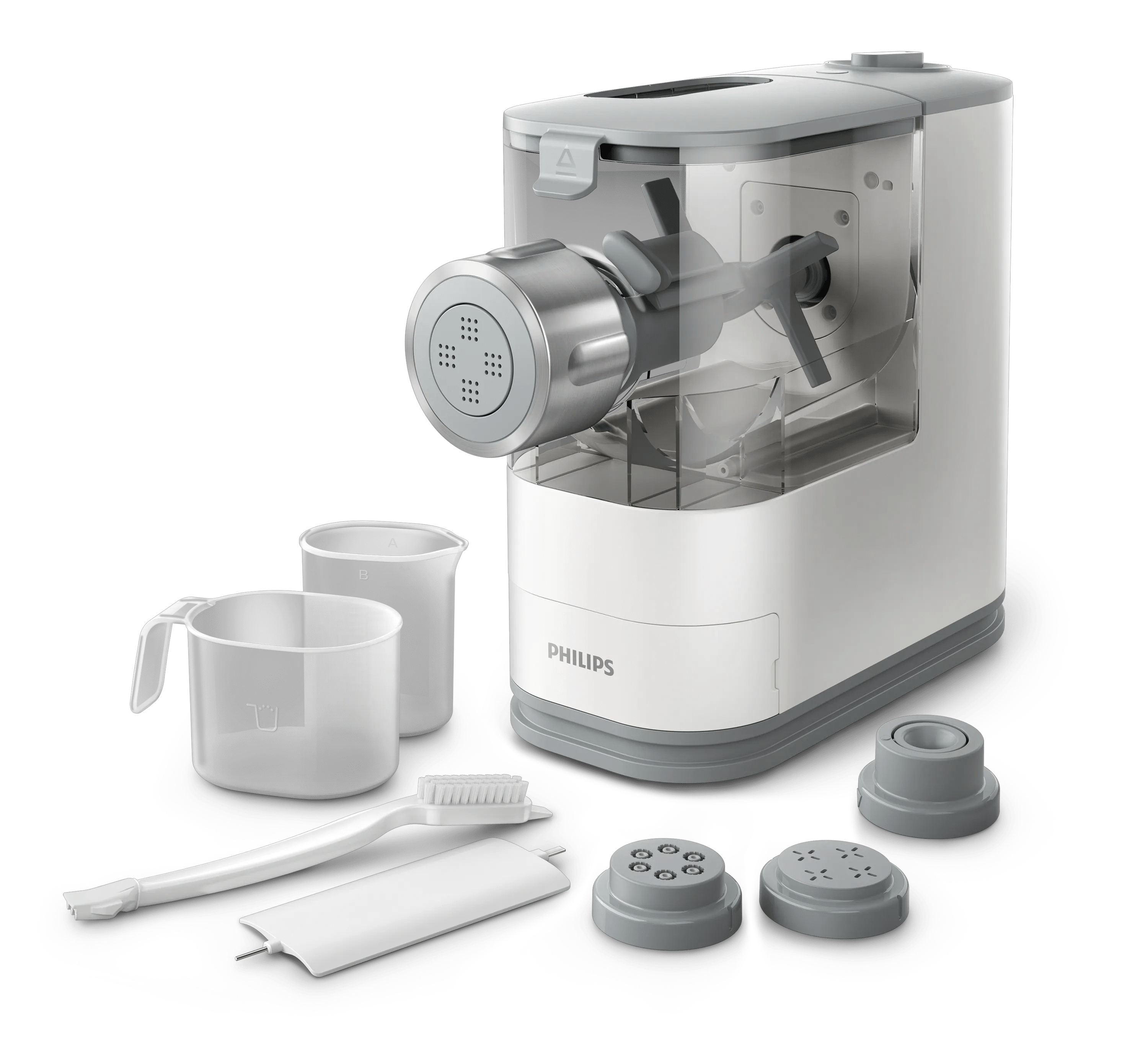 Una máquina para hacer pasta Philips blanca con accesorios como tazas medidoras, discos y un cepillo.