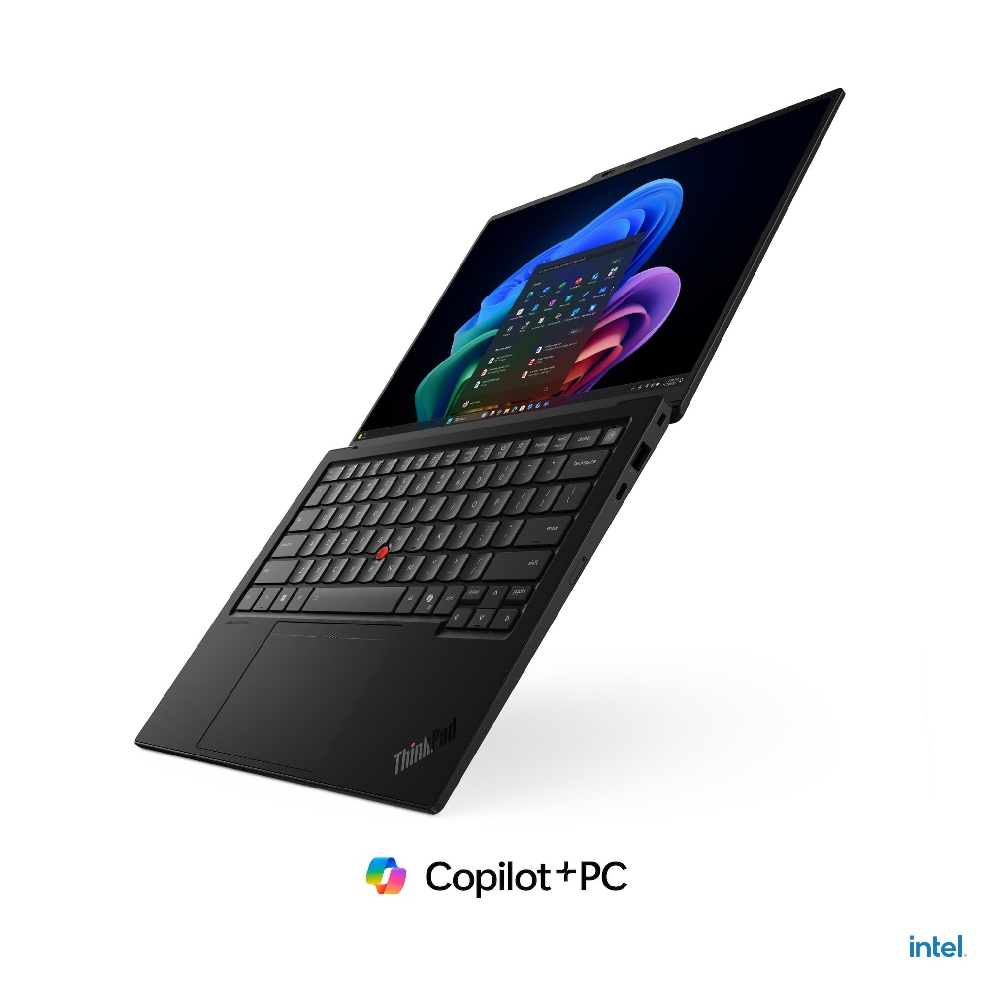Un elegante laptop nero mostra uno schermo Windows colorato su sfondo bianco con loghi Intel e Copilot.
