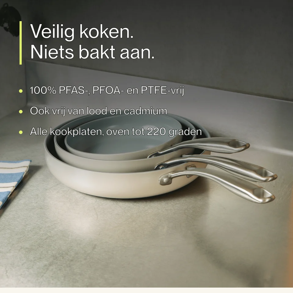 Three light-colored frying pans stacked together on a metal surface with promotional text above.