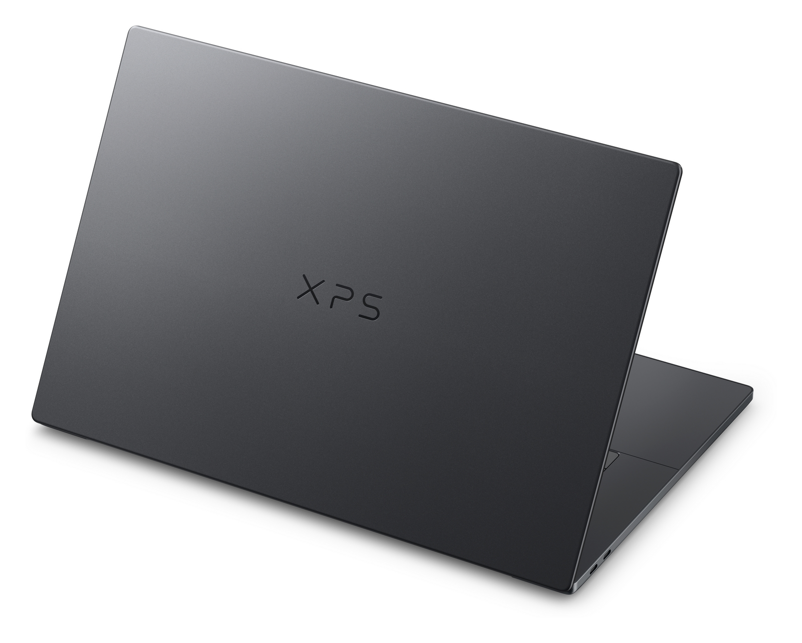Un laptop XPS grigio poggia su una superficie bianca su sfondo bianco.