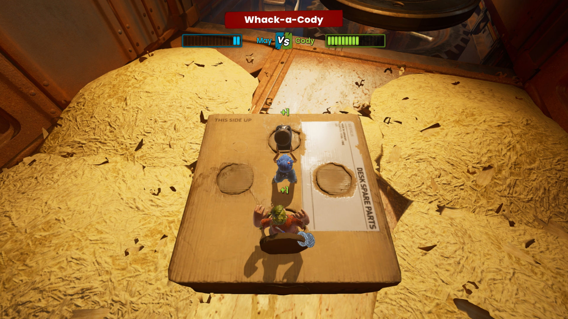 Ein Whack-a-Cody-Minispiel im Spiel, bei dem Figuren auf einer Pappkiste mit Spänen im Hintergrund auf tauchen.