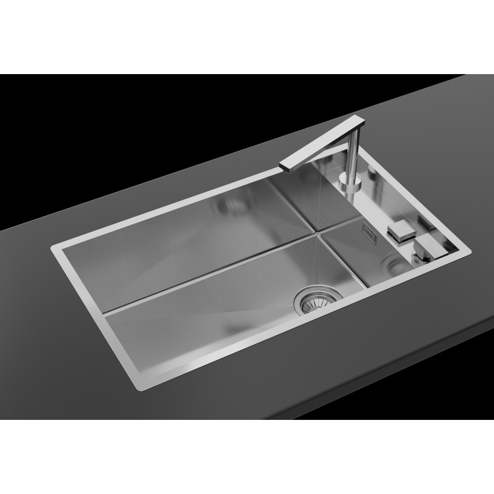 Un moderno lavello da cucina in acciaio inossidabile su un piano scuro, con rubinetto elegante.