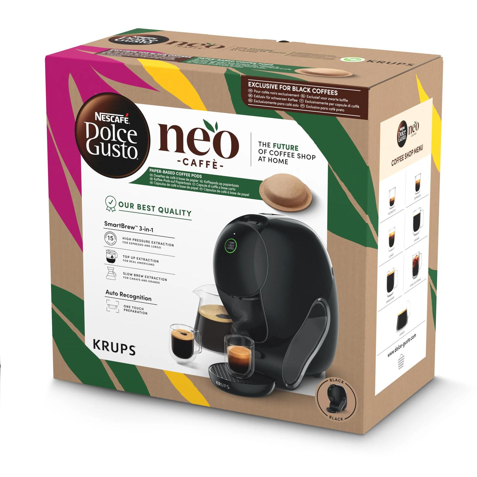 Confezione della macchina da caffè Krups Nescafé Dolce Gusto Neo con tazze da caffè su un tavolo.