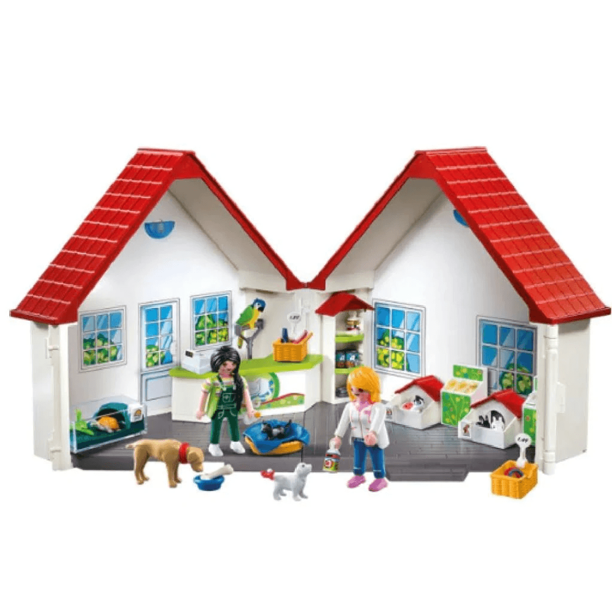 Set de tienda de mascotas Playmobil con dos figuras, animales, casetas y estantes en un edificio con techos rojos.